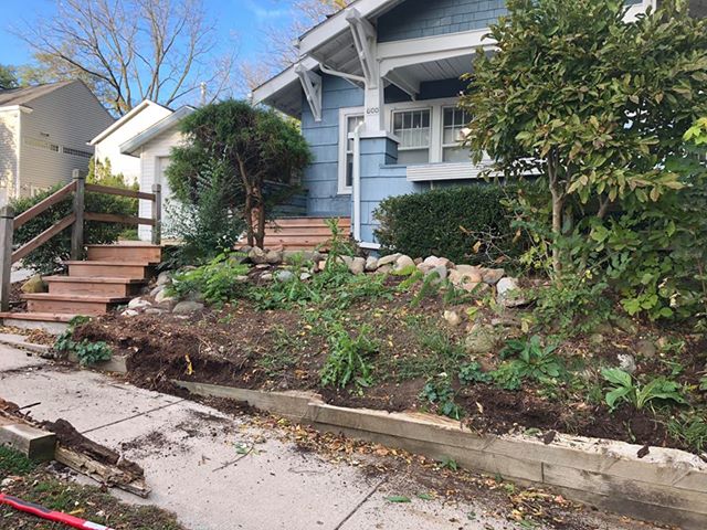 Front planting bed stripped back for renovation at a craftsman home